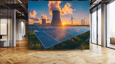 A field of solar panels at sunset with a nuclear power plant and wind turbines in the background. Wall mural