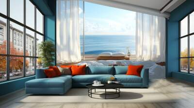 A white bedroom with large windows overlooking a blue ocean.  A tray with two cups of coffee sits on the bed. Wall mural