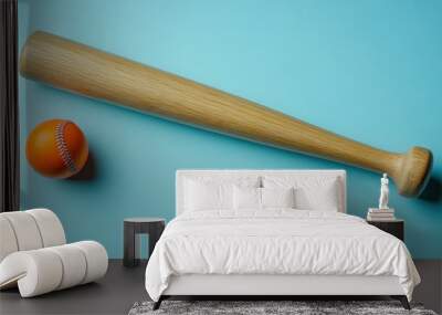 Baseball bat and ball on a blue background. Wall mural