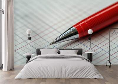 Close-up of a red pen on a sheet of grid paper. Wall mural