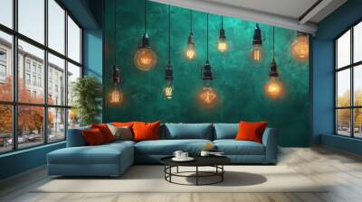 Row of vintage light bulbs hanging against a teal wall. Wall mural