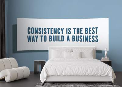 Consistency is the best way to build a business. A card isolated on blue background. Wall mural