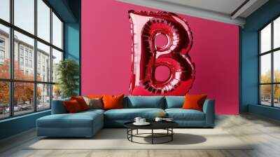 Claret-colored foil balloon shaped like the letter 