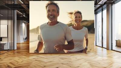 Smiley middle aged Caucasian couple during jogging workout on the beach. Jogging workout. Wall mural