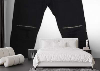 Black isolated on a white background. Men's jeans are isolated. Close-up of trendy stylish men's black jeans pants with a zipper on his knees on a white background. Wall mural