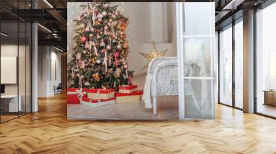 Christmas Tree and Christmas gift boxes in the interior with a fireplace. Wall mural