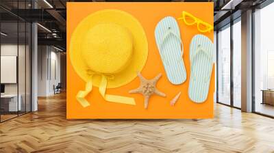 Flat lay with colorful beach accessories on color background. Vacation concept Wall mural