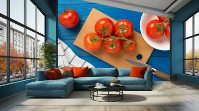 Fresh tomatoes on wooden background, top view Wall mural