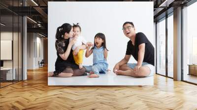 Asian family of four on white background Wall mural