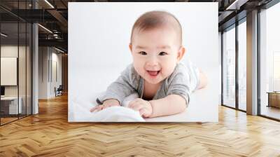 Close-up of cute Asian baby playing on the floor Wall mural