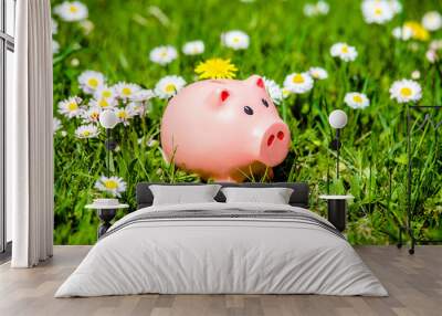 Piggy Bank on the background of blooming daisies  Wall mural