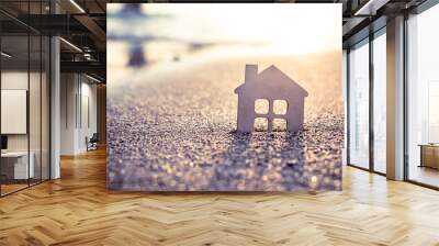 symbol of the house at sunset on the seashore  Wall mural