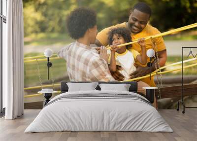  African American family having fun outdoors. Wall mural