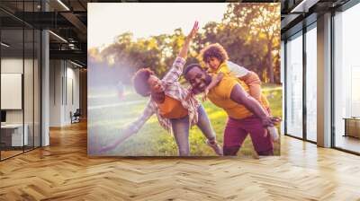  African American family having fun outdoors. Wall mural