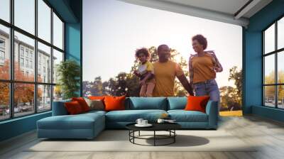  African American family having fun outdoors. Wall mural