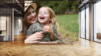 Cheerful family outdoor. Wall mural