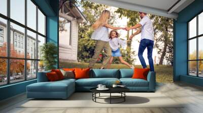 Family dancing in backyard. Wall mural