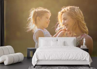 The love of mother and daughter is strong. Wall mural