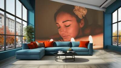 Woman enjoying a massage treatment. Wall mural