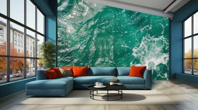 Top view of calm and clean blue and green water with reflections of the sun Wall mural