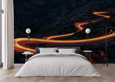 A winding road with a bright orange glow Wall mural