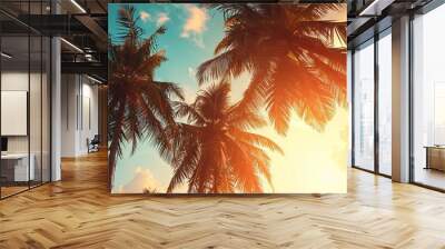 Transport yourself to a serene oasis with this vintage-inspired image capturing the beauty of palm trees against a backdrop of a stunning sunset Wall mural