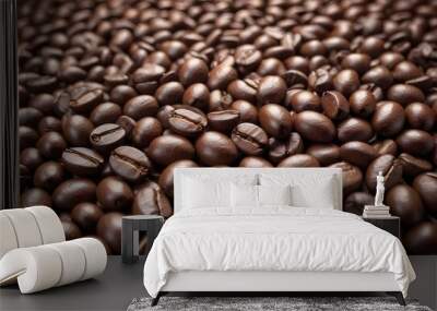 Close-up of roasted coffee beans, with their rich brown color and textured surfaces filling the frame Wall mural