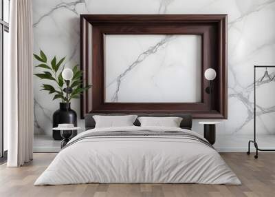 Empty dark raw wood frame, inner free space, white marble wall behind it Wall mural