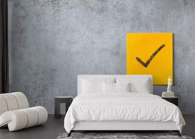 Check mark drawn on a Yellow Sticky Note - against an isolated background with Copy space. Wall mural