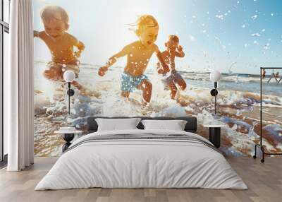 Group of children playing on beach and splashing in the ocean waves. Wall mural