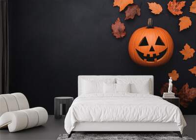 Overhead autumn and halloween photograph with in the center a carved pumpkin.  Wall mural