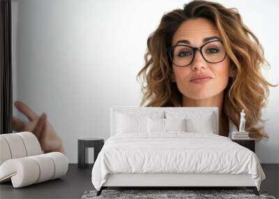 A confident woman with glasses, wearing a white shirt, gesturing with her hand in a professional manner, possibly in a business setting, against a plain white background. Wall mural