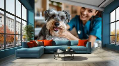 a contented woman in casual attire smiles warmly as she cuddles with her playful schnauzer puppy ind Wall mural