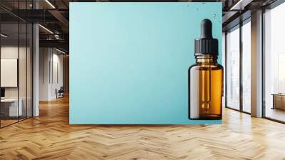 A decorative serum bottle against a fresh aqua background, surrounded by bubbles, capturing the essence of freshness and purity in skincare products. Wall mural