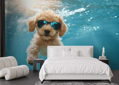 A delightful dog, sporting blue sunglasses, is captured mid-swim underwater. This fun-loving canine epitomizes joy and playful adventure on a sunny day. Wall mural