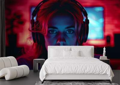 Young female wearing gaming headset with dramatic red and blue lighting accentuating her features Wall mural