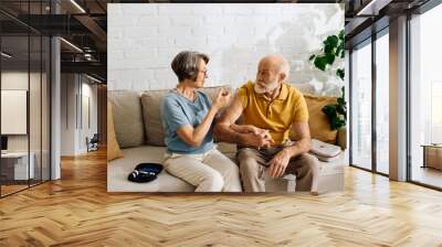 A devoted wife assists her husband with diabetes, ensuring his well being at home. Wall mural