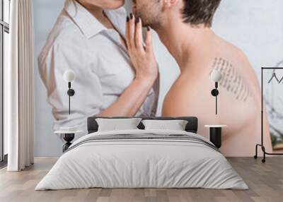 adult boyfriend embracing girlfriend with passion and closed eyes Wall mural