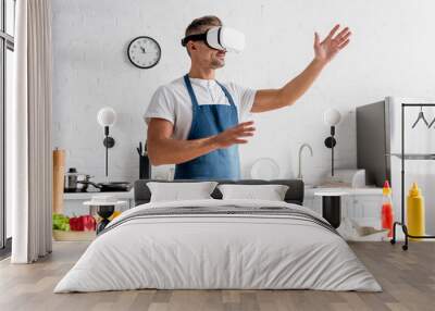 adult cooker in virtual reality headset standing at kitchen Wall mural