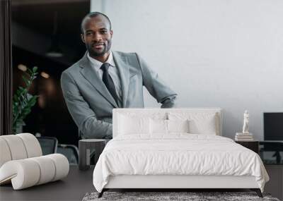 african american businessman sitting on table in office Wall mural