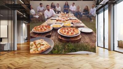 an extreme long shot of a party scene with a large table covered in a spread of junk food like pizza, wings, sliders, and various desserts. Show the full party setup including decorations and guests Wall mural