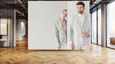 attractive male and female models in stylish vintage clothes on white Wall mural