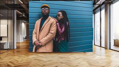 beautiful african american couple in fashionable outfit posing together outside Wall mural