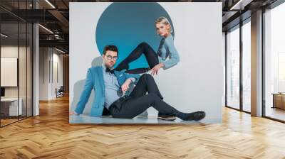 beautiful stylish young couple looking at camera in studio Wall mural