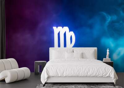 blue illuminated Virgo zodiac sign with colorful smoke on background Wall mural