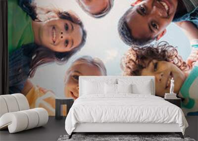 bottom view of cheerful multicultural kids looking at camera Wall mural