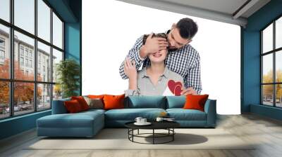 boyfriend covering girlfriends eyes and giving valentines postcard isolated on white Wall mural