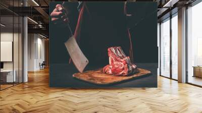 butcher with cleaver and raw meat on wooden cutting board Wall mural