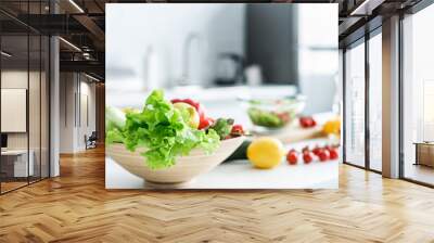 close-up view of bowl with fresh healthy vegetables on kitchen table Wall mural