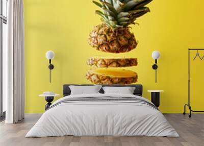 close up view of cut ripe pineapple exotic fruit isolated on yellow Wall mural